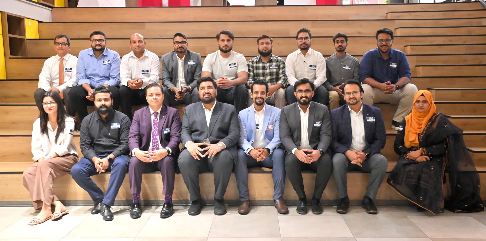 Participants and facilitators of a sales capability workshop seated together for a group photograph